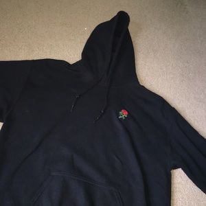 black hoodie with rose patch
